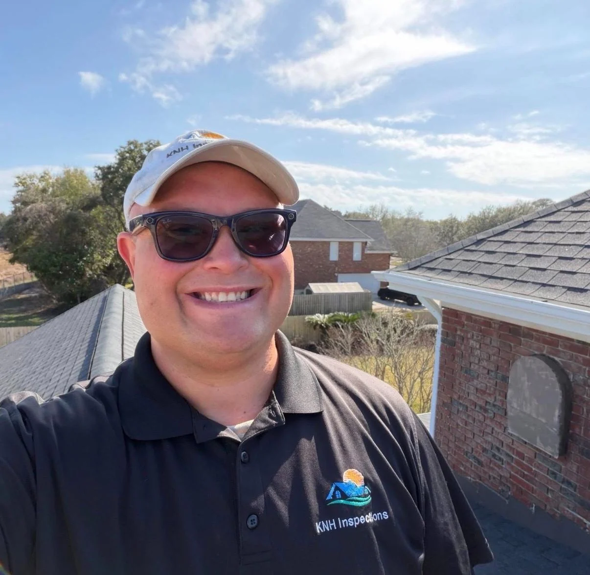Kevin Foster of KNH Inspections smiling on a roof during an inspection